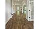 Spacious living area featuring hardwood floors, elegant archways, and a fireplace in a light-filled, open layout at 222 Silvercrest Dr, Acworth, GA 30101