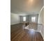 Open loft area with wood floors, and contemporary chandelier at 222 Silvercrest Dr, Acworth, GA 30101