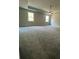 Large main bedroom with plush carpet, tray ceiling, and an abundance of natural light at 222 Silvercrest Dr, Acworth, GA 30101