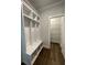 This mudroom features a built-in bench with storage and access to a closet at 222 Silvercrest Dr, Acworth, GA 30101