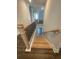 Wooden staircase with metal railing leads to the lower level at 222 Silvercrest Dr, Acworth, GA 30101