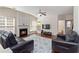 Spacious living room with hardwood floors, fireplace, and a modern TV setup at 310 Hammersmith Dr, Suwanee, GA 30024