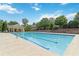 Beautiful pool area with ample seating and covered seating section for residents use at 310 Hammersmith Dr, Suwanee, GA 30024