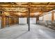 Unfinished basement area with exposed beams and concrete floor at 3232 Watson Mill Dr, Loganville, GA 30052