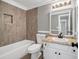 Stylish bathroom with tiled walls, granite countertop, and modern fixtures at 3232 Watson Mill Dr, Loganville, GA 30052