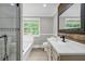 Elegant bathroom with double sinks, quartz counters, and stylish finishes at 3232 Watson Mill Dr, Loganville, GA 30052