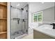 Modern bathroom features a glass-enclosed shower and separate soaking tub at 3232 Watson Mill Dr, Loganville, GA 30052