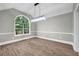 Elegant dining room featuring wood floors, natural light, and modern chandelier at 3232 Watson Mill Dr, Loganville, GA 30052