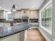 Kitchen with granite countertops, stainless steel appliances, and custom cabinets at 3232 Watson Mill Dr, Loganville, GA 30052