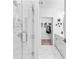 Bright bathroom showcasing a sleek glass shower, elegant white cabinetry, and a walk-in closet at 371 Grant Se Cir # 1823, Atlanta, GA 30315