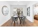 Inviting dining area featuring a round table, four chairs, and access to an outdoor balcony at 371 Grant Se Cir # 1823, Atlanta, GA 30315