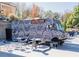 BUTECO black and white painted food truck sits in a parking lot ready to serve customers at tables at 371 Grant Se Cir # 1823, Atlanta, GA 30315