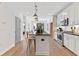 Contemporary kitchen with white cabinetry, stainless steel appliances, and a central island with barstool seating at 371 Grant Se Cir # 1823, Atlanta, GA 30315