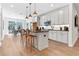 Modern kitchen with stainless steel appliances, white cabinets, and a center island with seating at 371 Grant Se Cir # 1823, Atlanta, GA 30315