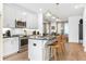 Modern kitchen featuring stainless steel appliances, gray cabinets, and a breakfast bar with stylish seating at 371 Grant Se Cir # 1823, Atlanta, GA 30315