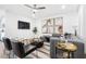 Open-concept living room with a plush sofa, modern furnishings, and large-screen TV at 371 Grant Se Cir # 1823, Atlanta, GA 30315