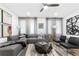 Stylish living room showcasing a comfortable sectional sofa, modern art, and ample natural light at 371 Grant Se Cir # 1823, Atlanta, GA 30315