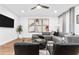 Bright living room with a gray sectional sofa, black accents, and contemporary decor at 371 Grant Se Cir # 1823, Atlanta, GA 30315