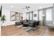 Well-lit living room featuring a gray sectional, modern art, and contemporary decor at 371 Grant Se Cir # 1823, Atlanta, GA 30315