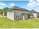 Well-kept yard with a covered patio and plenty of room for activities, offering an ideal outdoor living area at 4191 Hosch Reserve Dr, Buford, GA 30519