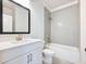 Updated bathroom with a modern vanity, chrome fixtures, and a tiled tub/shower combo at 4191 Hosch Reserve Dr, Buford, GA 30519