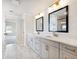 Modern bathroom with double sinks and marble floors at 4191 Hosch Reserve Dr, Buford, GA 30519