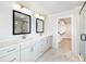 Bright bathroom featuring double vanity and glass-enclosed shower at 4191 Hosch Reserve Dr, Buford, GA 30519