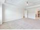 Neutral bedroom with walk-in closet and tray ceiling at 4191 Hosch Reserve Dr, Buford, GA 30519