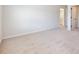 A bright and airy bedroom with neutral carpet and a glimpse into the adjoining bathroom at 4191 Hosch Reserve Dr, Buford, GA 30519
