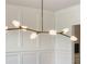 Modern chandelier with branch-like design and sculptural shades, illuminating a room with natural light at 4191 Hosch Reserve Dr, Buford, GA 30519