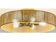 Stylish, round chandelier with a woven shade and multiple bulbs provides warm and inviting lighting at 4191 Hosch Reserve Dr, Buford, GA 30519