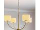 A stylish chandelier with cream shades hangs from the ceiling, adding a touch of elegance at 4191 Hosch Reserve Dr, Buford, GA 30519