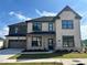 Beautiful two-story home with a two car garage, manicured lawn and gorgeous curb appeal at 4191 Hosch Reserve Dr, Buford, GA 30519