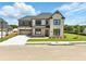 Inviting two-story home showcasing a brick facade, attached garage, and lush front lawn at 4191 Hosch Reserve Dr, Buford, GA 30519