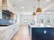 Stunning kitchen with an island, gas range cooktop, stainless steel appliances, and easy access to living spaces at 4191 Hosch Reserve Dr, Buford, GA 30519