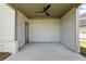 Covered patio with ceiling fan, offering a comfortable outdoor space for relaxation and enjoying the fresh air at 4191 Hosch Reserve Dr, Buford, GA 30519
