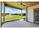 Covered patio boasting stunning views of the expansive backyard, perfect for enjoying nature's beauty at 4191 Hosch Reserve Dr, Buford, GA 30519