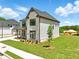 Well-maintained home with a combination of brick and siding, enhanced by a verdant lawn and tidy landscaping at 4191 Hosch Reserve Dr, Buford, GA 30519
