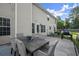 Outdoor patio with outdoor dining and a grill in a fenced backyard at 423 Blackbird Way, Hampton, GA 30228