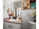 Bathroom with a pedestal sink, decorative items, and a view of the home's interior at 423 Blackbird Way, Hampton, GA 30228