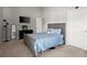 Comfortable bedroom features neutral colors, ample closet space, and plenty of natural light at 423 Blackbird Way, Hampton, GA 30228