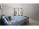 Cozy bedroom with vaulted ceiling featuring natural light and neutral decor at 423 Blackbird Way, Hampton, GA 30228