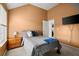 Inviting bedroom with warm colors and a comfortable bed, plus easy access to the ensuite bathroom at 423 Blackbird Way, Hampton, GA 30228