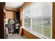 Walk-in closet with abundant storage and natural light from a large window at 423 Blackbird Way, Hampton, GA 30228