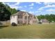 Charming, two-story brick home with a spacious yard in a peaceful neighborhood at 423 Blackbird Way, Hampton, GA 30228