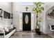Bright and airy foyer with stylish decor, wood floors and a decorative front door at 423 Blackbird Way, Hampton, GA 30228