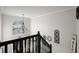 Bright foyer with high ceilings features a large window and decorative wrought iron chandelier at 423 Blackbird Way, Hampton, GA 30228