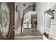 Inviting foyer featuring hardwood floors, a staircase, and a view of the dining room at 423 Blackbird Way, Hampton, GA 30228