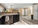 Stylish kitchen featuring dark cabinets, stainless steel appliances and granite countertops at 423 Blackbird Way, Hampton, GA 30228