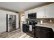 Modern kitchen with stainless steel refrigerator and granite countertops at 423 Blackbird Way, Hampton, GA 30228